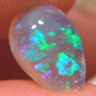 SOLID CRYSTAL OPAL Rolling flashes of green play in a 3D pattern 